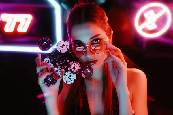 A close-up shot of golden coins falling around a spinning roulette wheel, representing immersive casino action at JDLOVE.